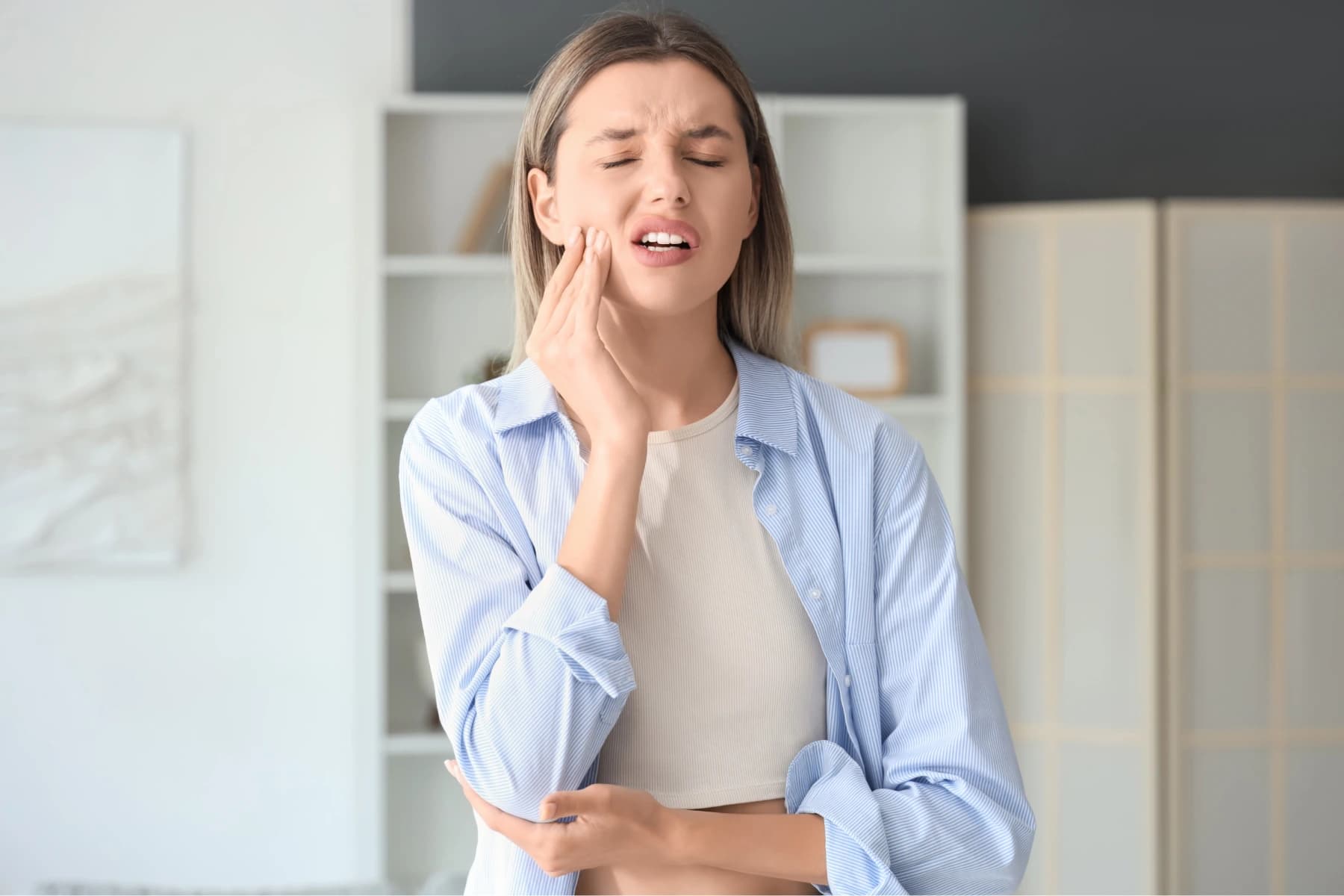 Patient experiencing dental pain — emergency dental care in Etobicoke